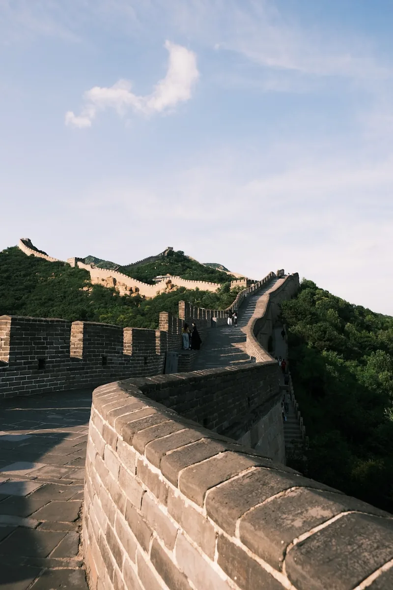 Great Wall of China winding through green hills