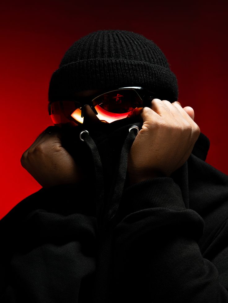 Campaign portrait on red with mirrored lenses